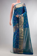 Pure Silk Peacock Blue Dual Tone Kanjivaram Saree with Zari Butta on the body and Zari Border.  displayed on a mannequin