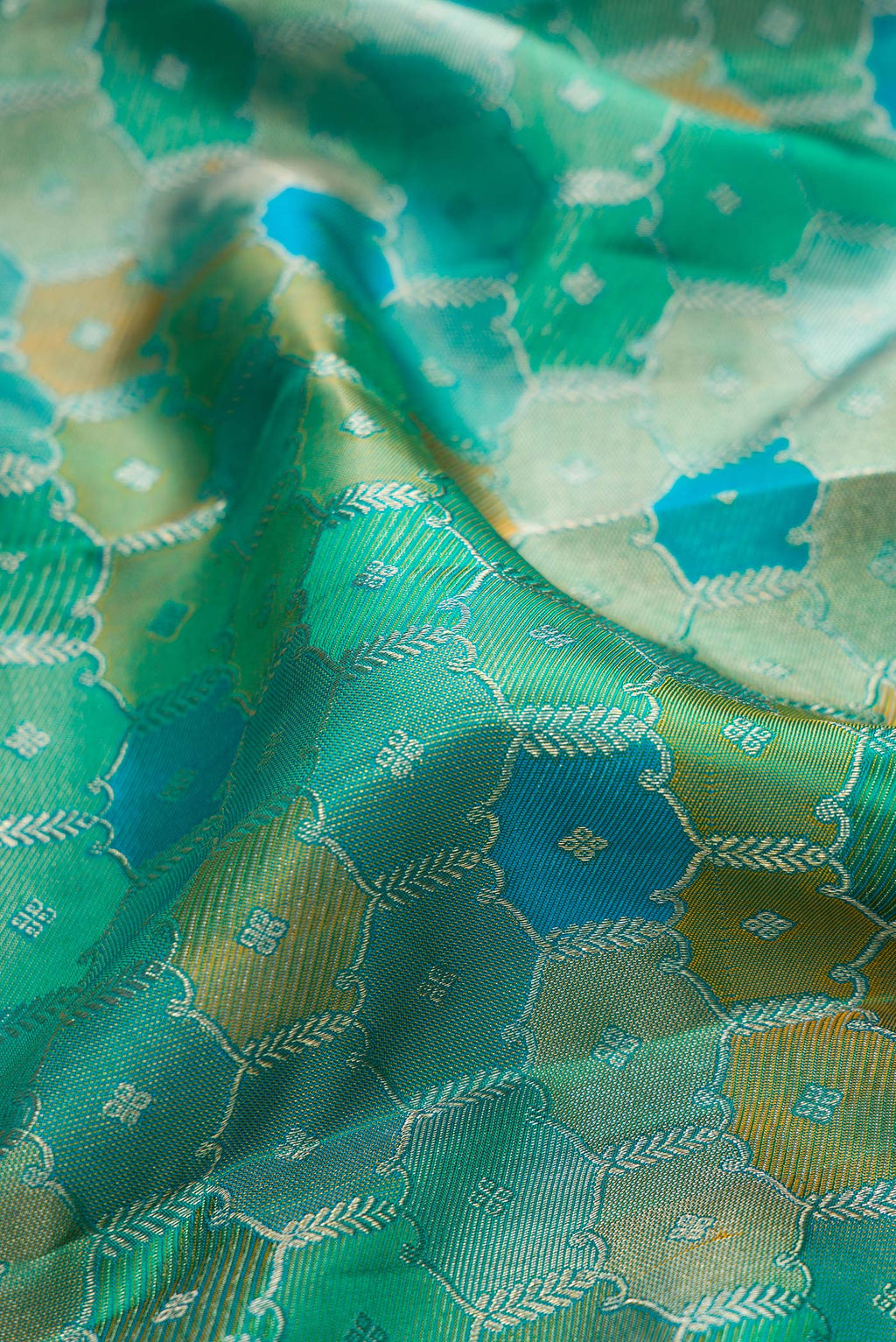 Close up of Pure Silk Sea Green Dual Tone Kanjivaram Saree with Zari Brocade on the body and Zari Border.  displaying folds
