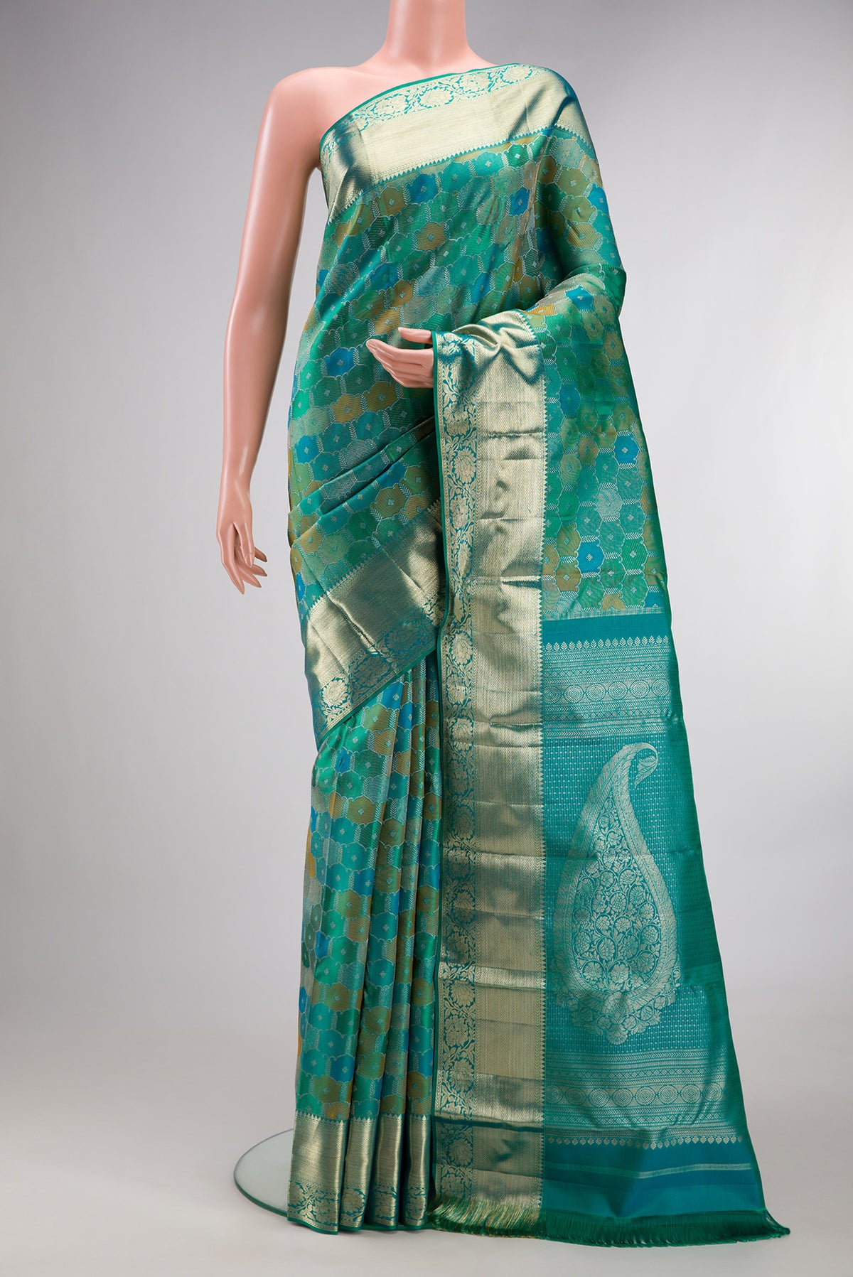 Pure Silk Sea Green Dual Tone Kanjivaram Saree with Zari Brocade on the body and Zari Border.  displayed on a mannequin