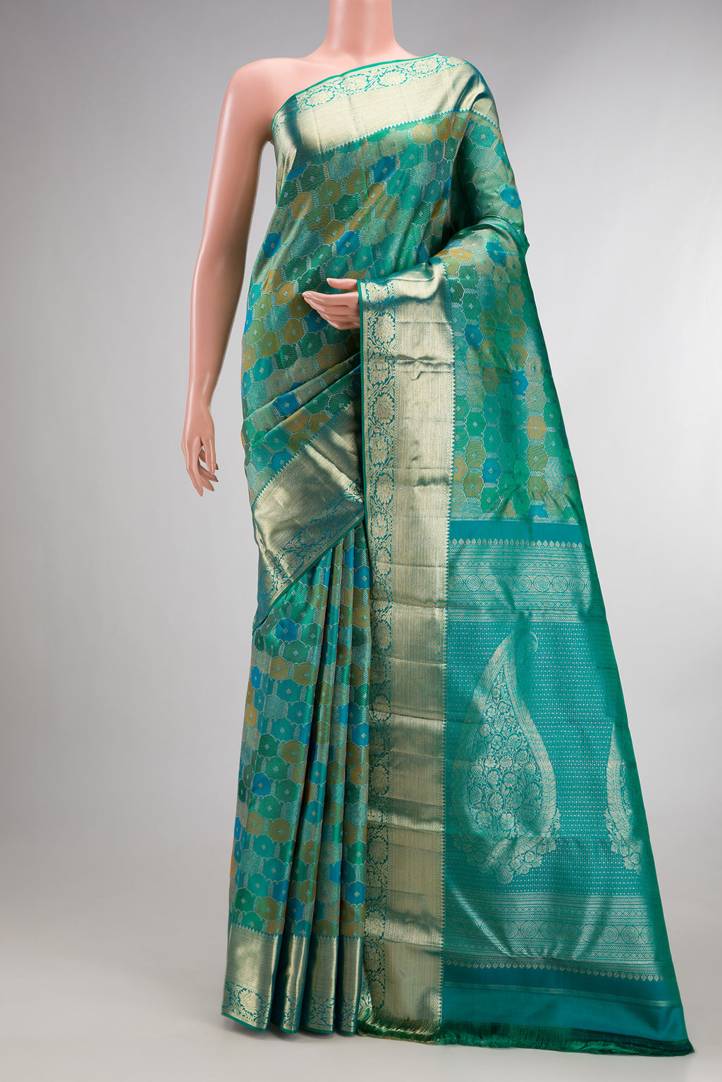 Pure Silk Sea Green Dual Tone Kanjivaram Saree with Zari Brocade on the body and Zari Border.  displayed on a mannequin