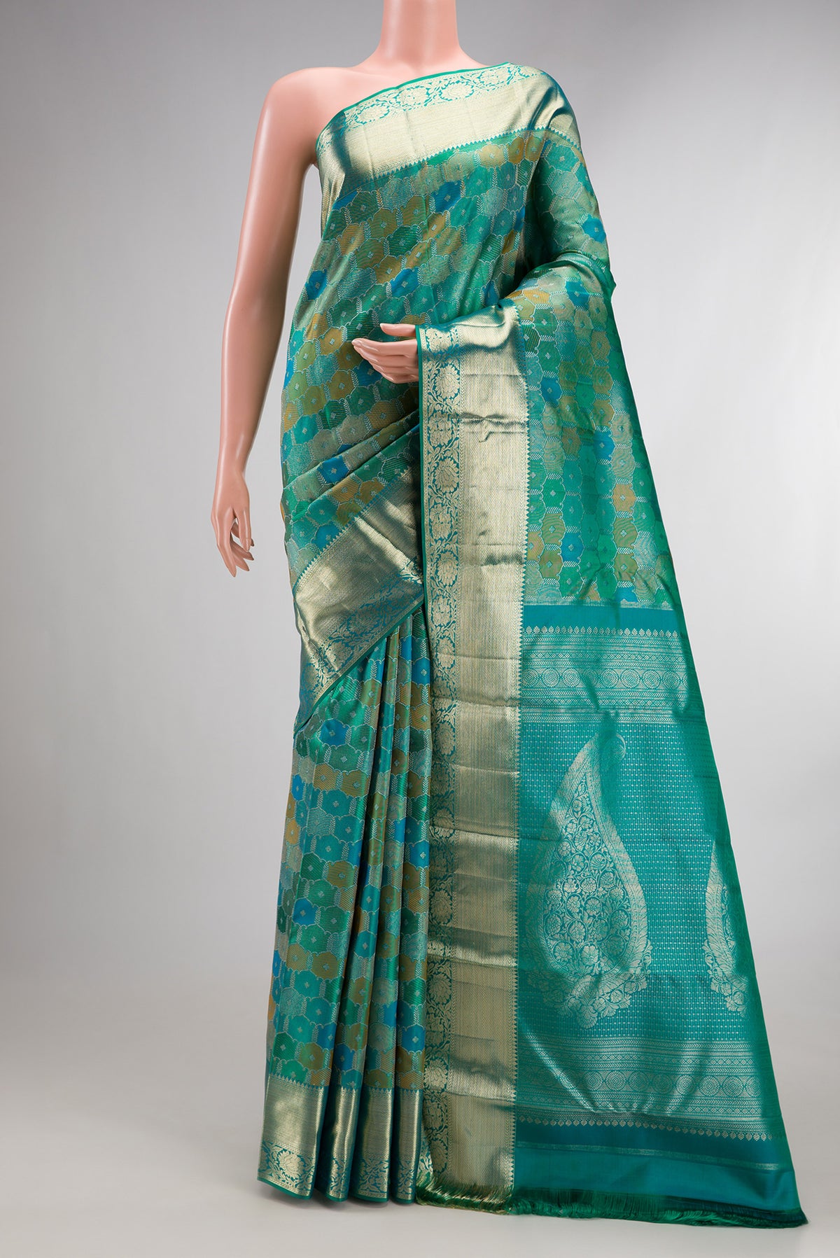 Pure Silk Sea Green Dual Tone Kanjivaram Saree with Zari Brocade on the body and Zari Border.  displayed on a mannequin
