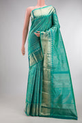 Pure Silk Turquoise Dual Tone Kanjivaram Saree with Zari Brocade on the body and Fancy Border.  displayed on a mannequin