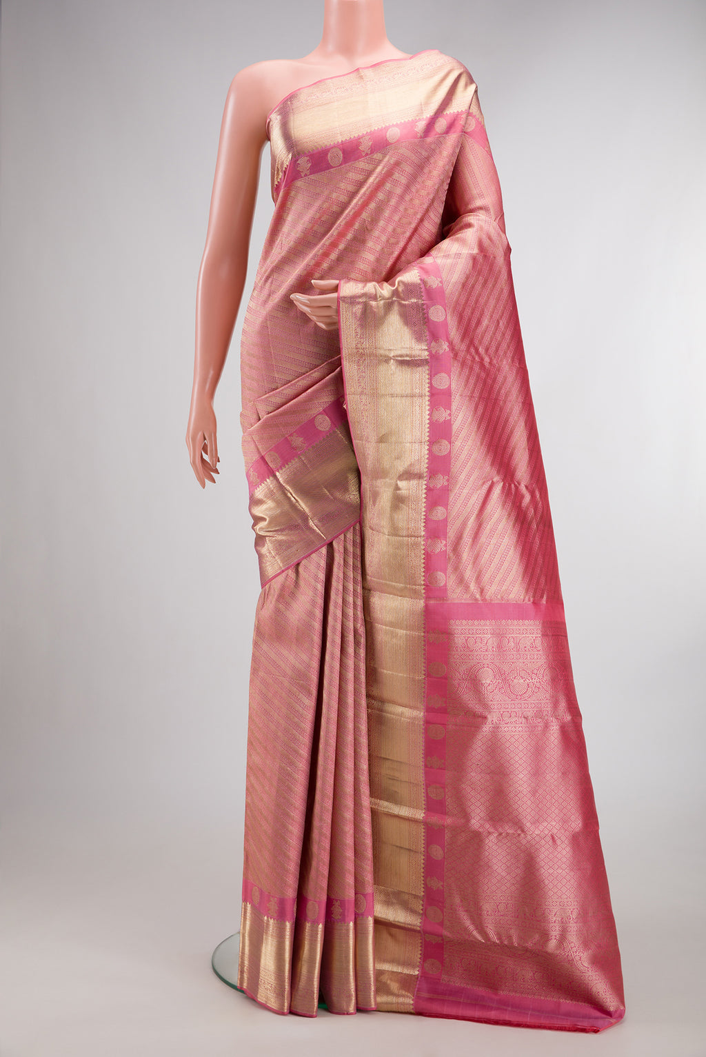 Pure Silk Rose pink Kanjivaram Saree with Zari Brocade on the body and Fancy Border.  displayed on a mannequin