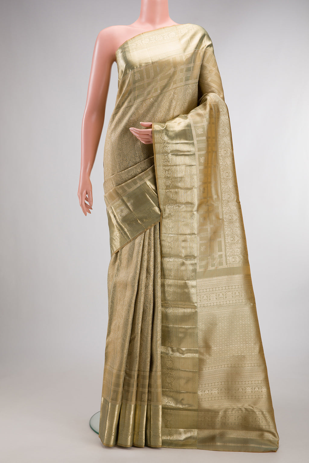 Pure Silk Beige Kanjivaram Saree with Zari Brocade on the body and Fancy Border.  displayed on a mannequin