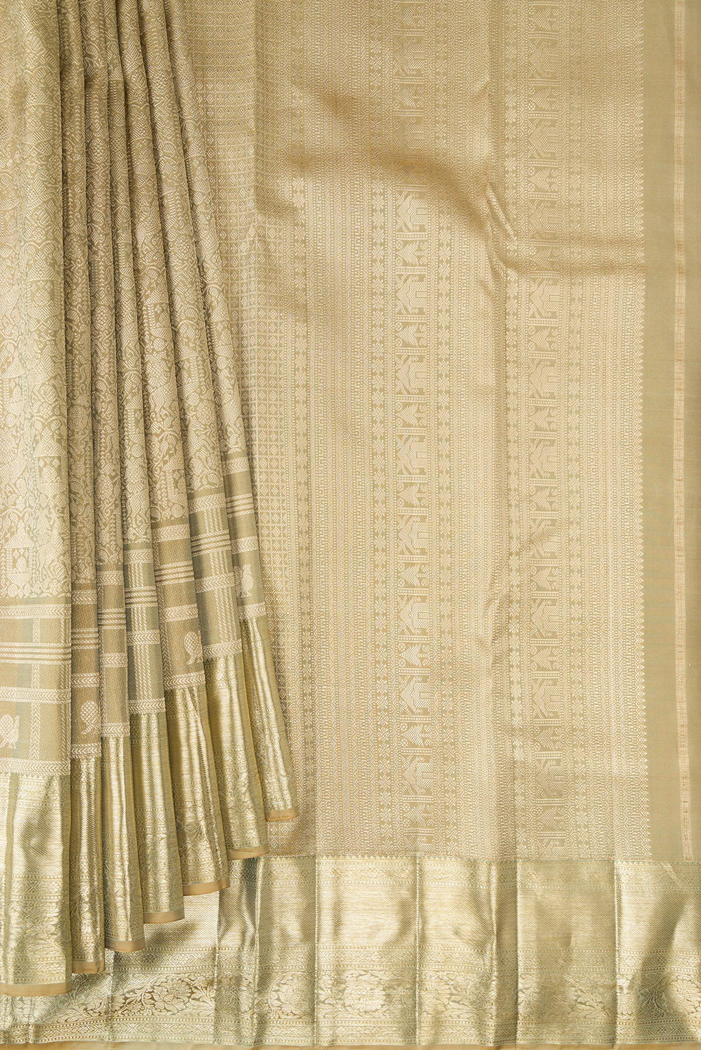 Pleats and pallu of Pure Silk Beige Kanjivaram Saree with Zari Brocade on the body and Fancy Border. 