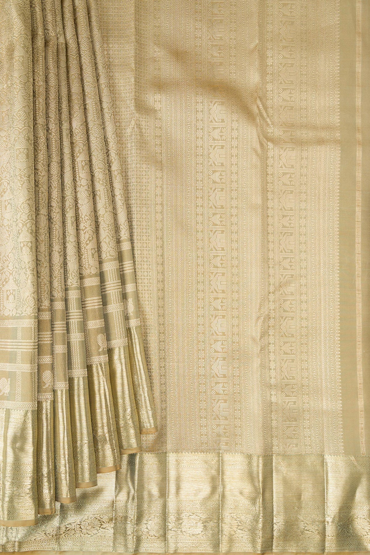 Pleats and pallu of Pure Silk Beige Kanjivaram Saree with Zari Brocade on the body and Fancy Border. 
