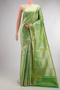 Pure Silk Light Green Kanjivaram Saree with Zari Brocade on the body and Zari Border.  displayed on a mannequin