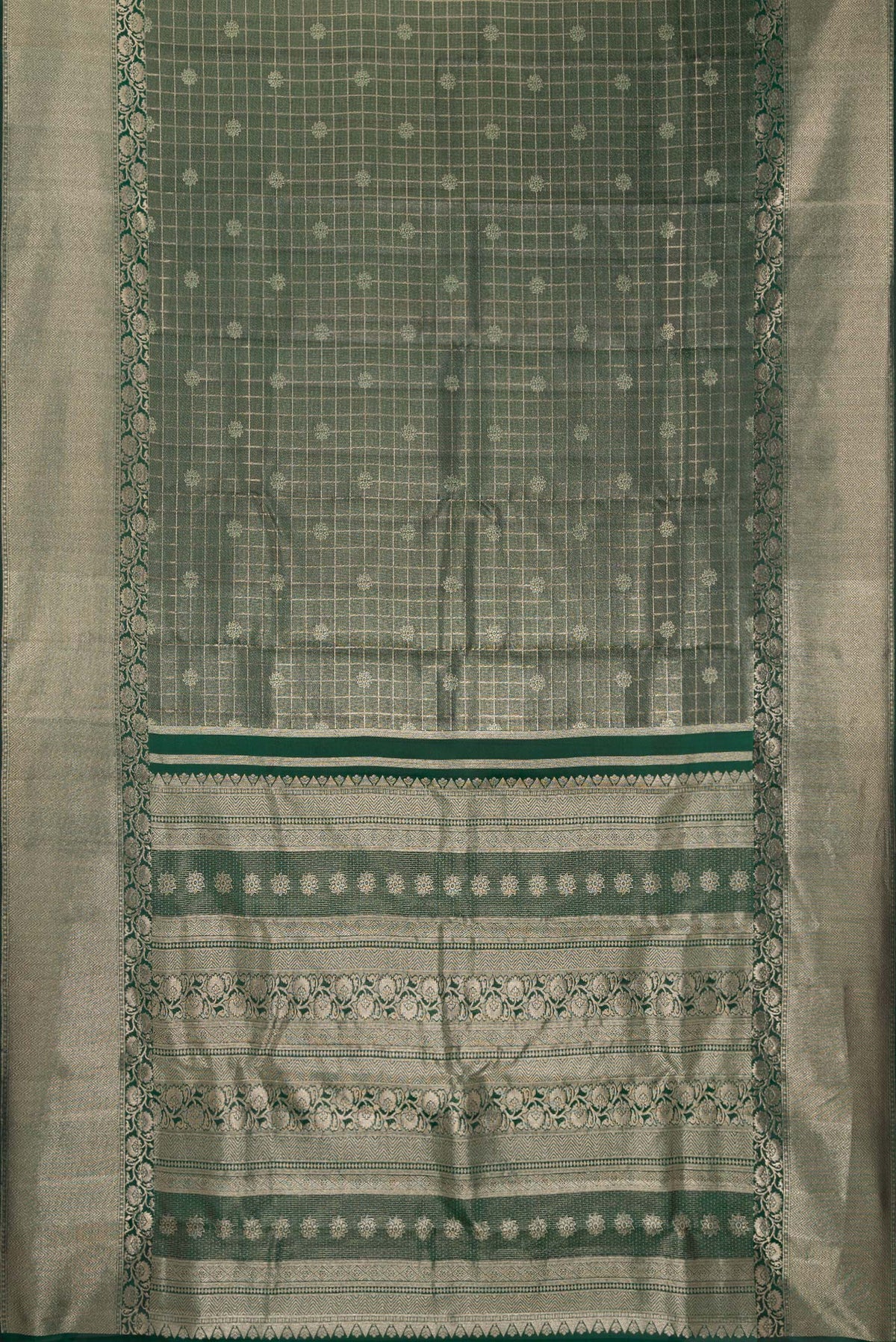 Flat view of Bottle Green Dual Tone Kanchipuram Tissue Saree with Zari Brocade on the body and Zari Border. 