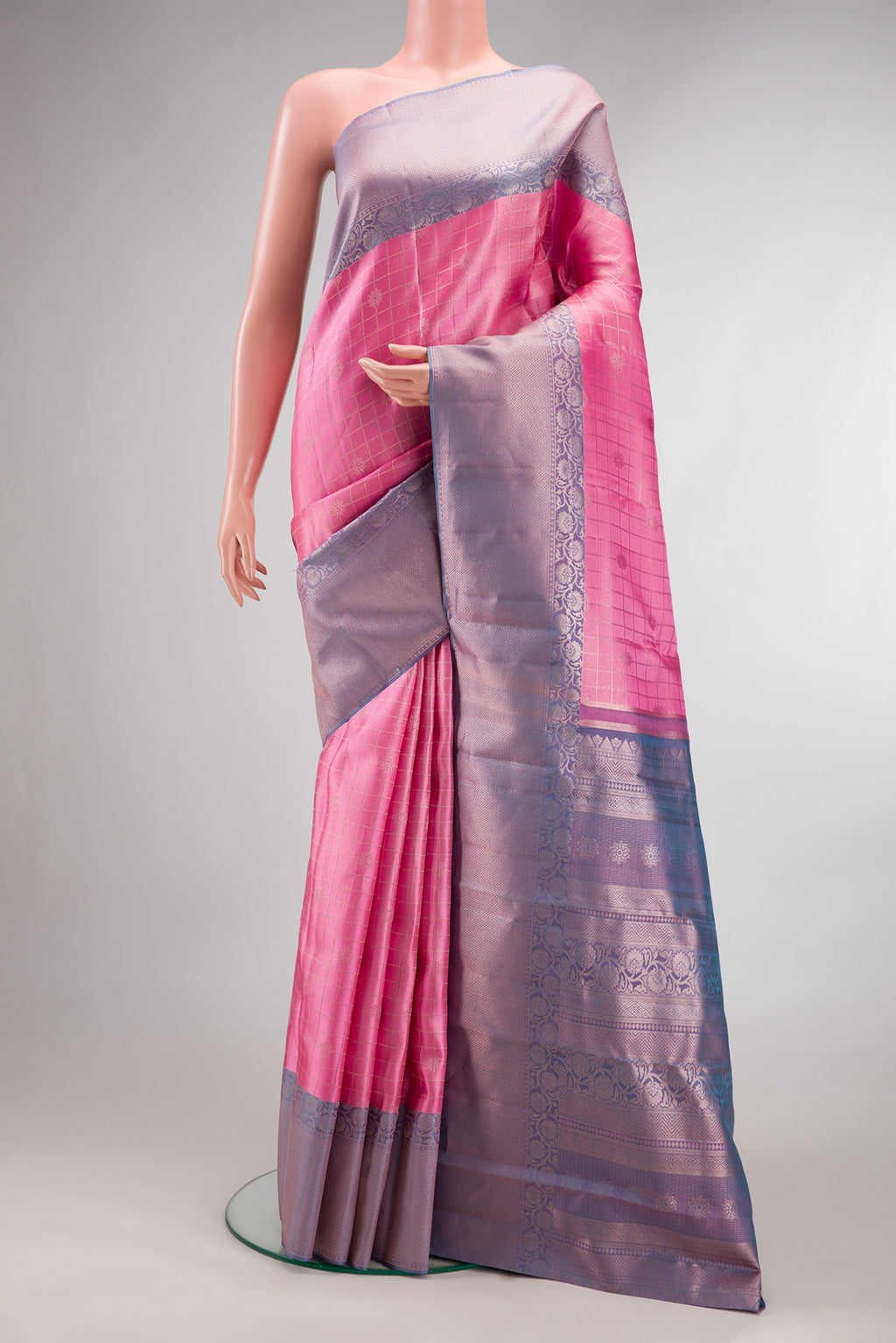 Pure Silk Pink Kanchipuram Saree with Checked design on the body and Fancy Border.  displayed on a mannequin