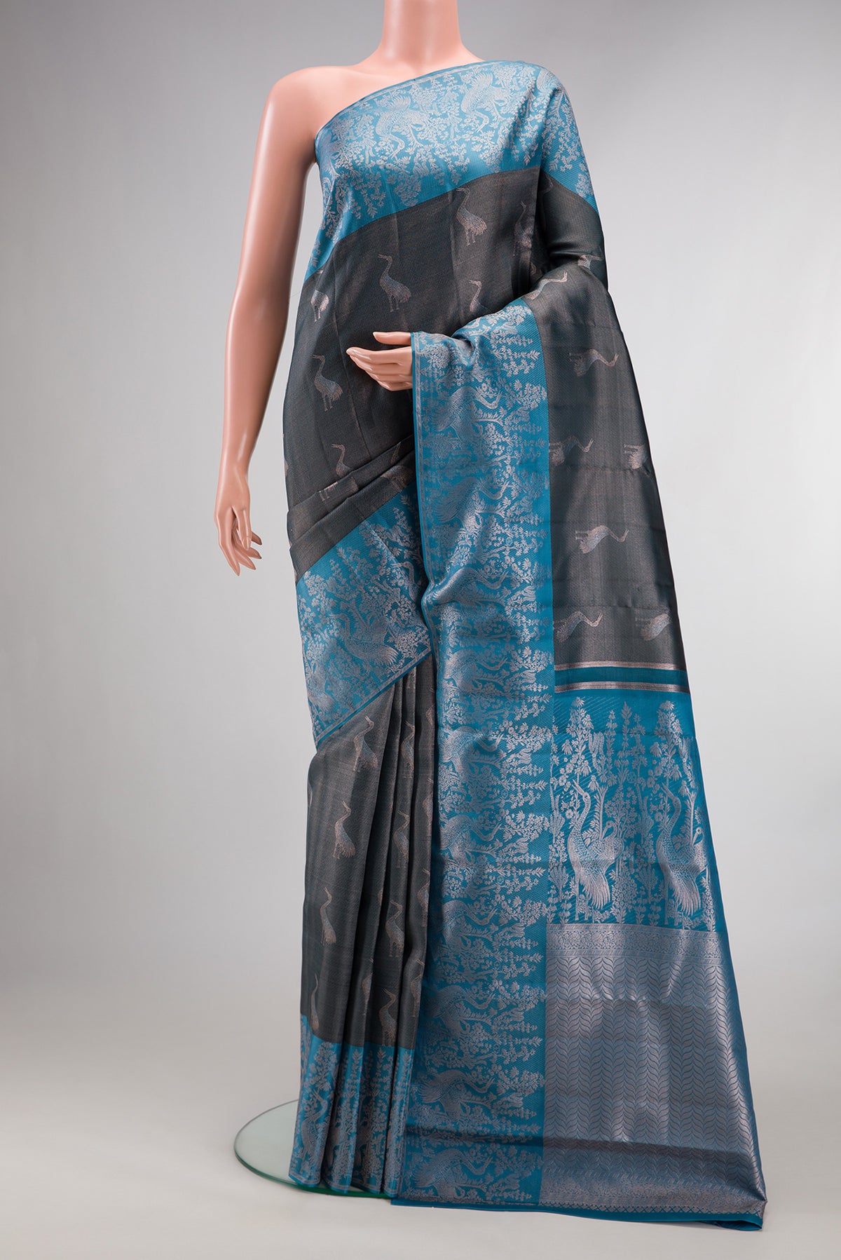 Grey Dual Tone Kanchipuram Tissue Saree with Zari Brocade on the body and Fancy Border.  displayed on a mannequin
