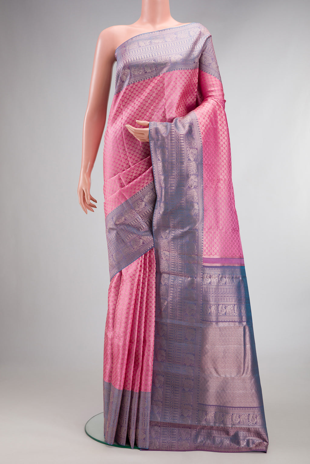 Rose pink Kanchipuram Tissue Saree with Zari Brocade on the body and Fancy Border.  displayed on a mannequin