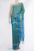 Green Silk Cotton Saree with Checked design on the body and Zari Border.  displayed on a mannequin