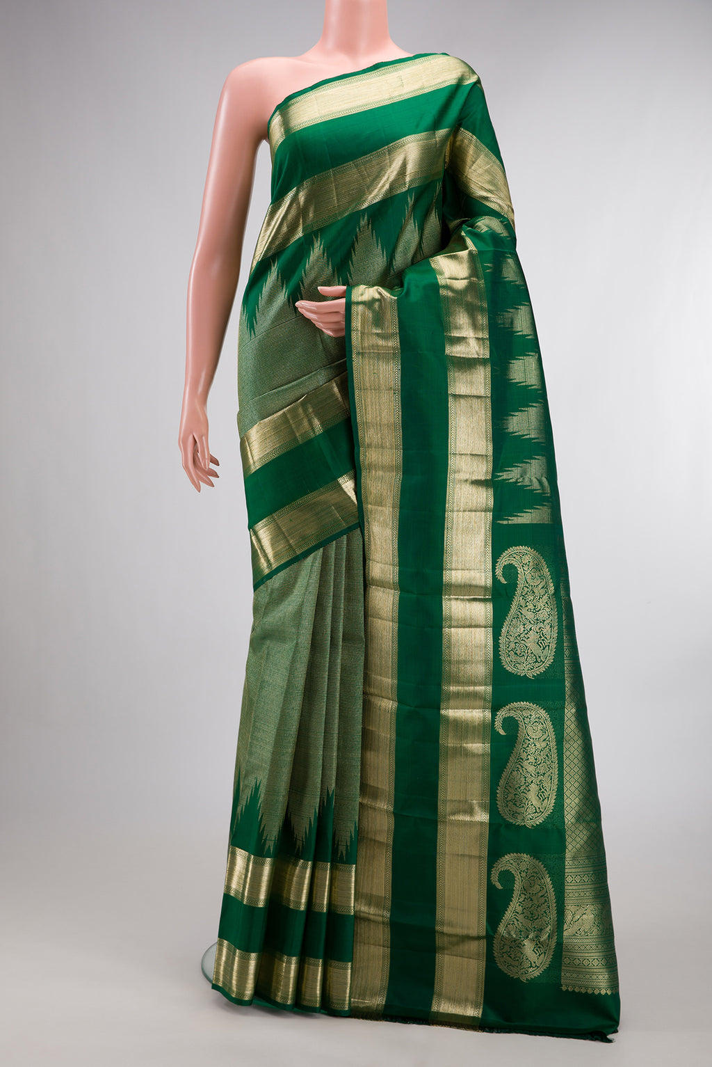 Pure Silk Green Kanchipuram Saree with Zari Brocade on the body and Temple Border.  displayed on a mannequin