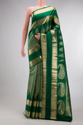 Pure Silk Green Kanchipuram Saree with Zari Brocade on the body and Temple Border.  displayed on a mannequin