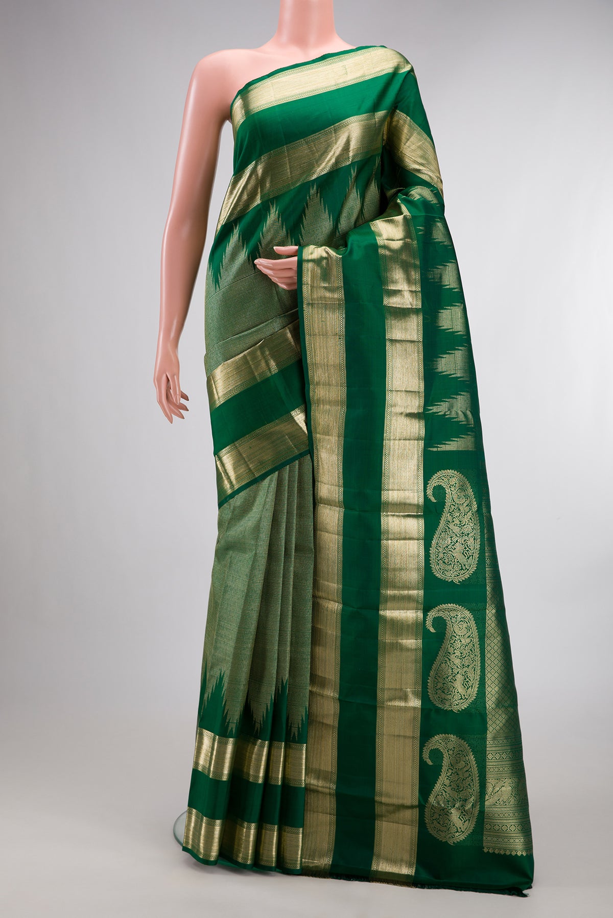 Pure Silk Green Kanchipuram Saree with Zari Brocade on the body and Temple Border.  displayed on a mannequin