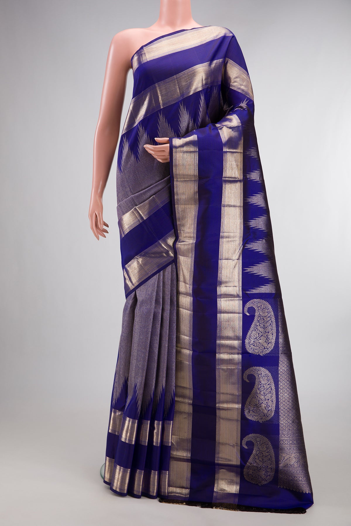 Pure Silk Royal Blue Dual Tone Kanchipuram Saree with Zari Brocade on the body and Temple Border.  displayed on a mannequin