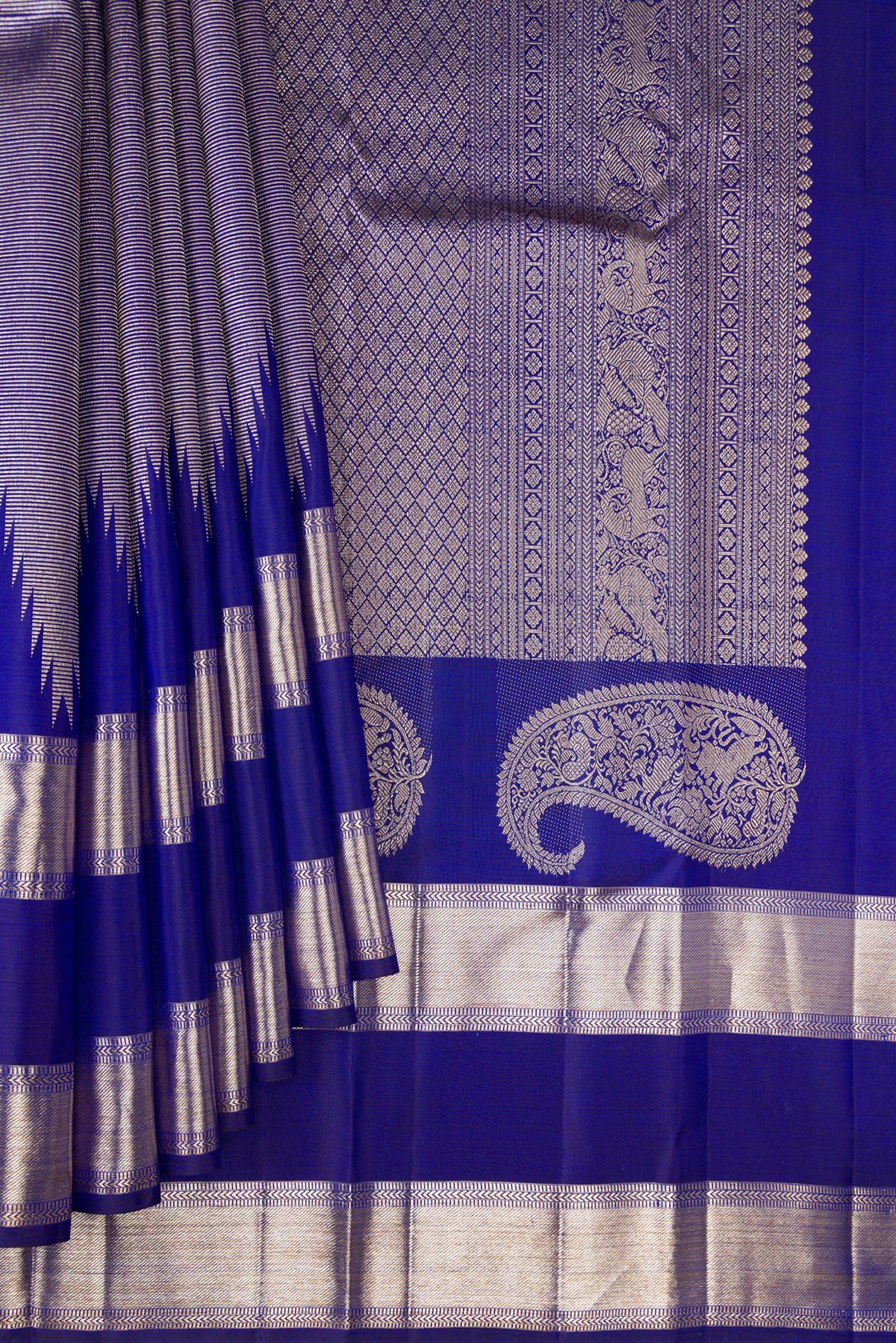 Pleats and pallu of Pure Silk Royal Blue Dual Tone Kanchipuram Saree with Zari Brocade on the body and Temple Border. 