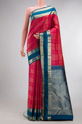 Pure Silk Dark Pink Kanchipuram Saree with Checked design on the body and Zari Border.  displayed on a mannequin