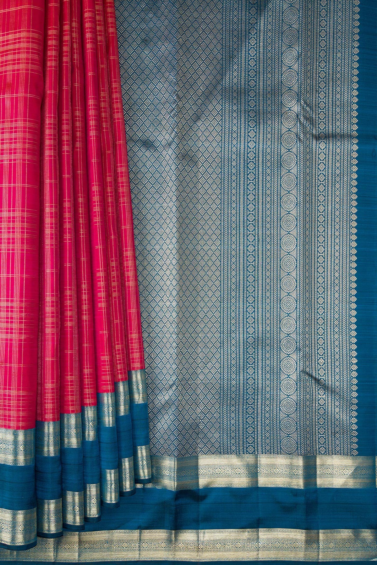Pleats and pallu of Pure Silk Dark Pink Kanchipuram Saree with Checked design on the body and Zari Border. 