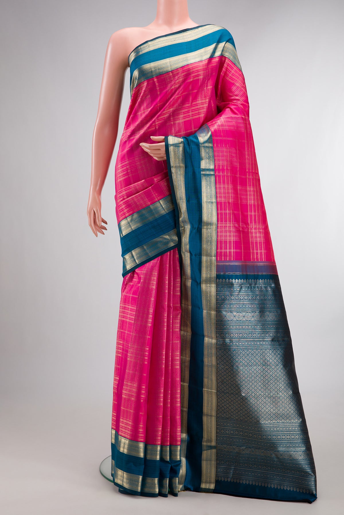 Pure Silk Pink Kanchipuram Saree with Checked design on the body and Zari Border.  displayed on a mannequin