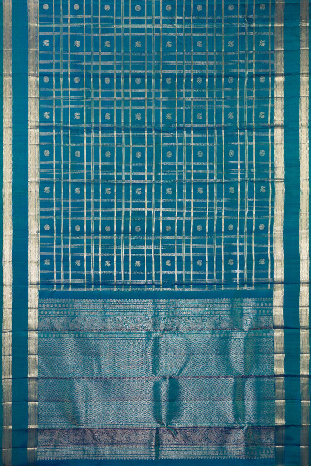 Flat view of Pure Silk Peacock Blue Dual Tone Kanchipuram Saree with Checked design on the body and Zari Border. 