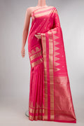 Pure Silk Pink Dual Tone Kanjivaram Saree with Zari Butta on the body and Fancy Border.  displayed on a mannequin