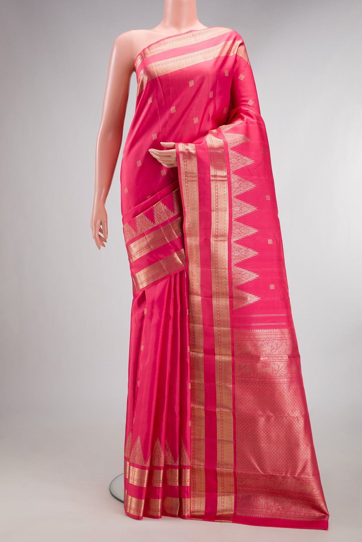 Pure Silk Pink Dual Tone Kanjivaram Saree with Zari Butta on the body and Fancy Border.  displayed on a mannequin