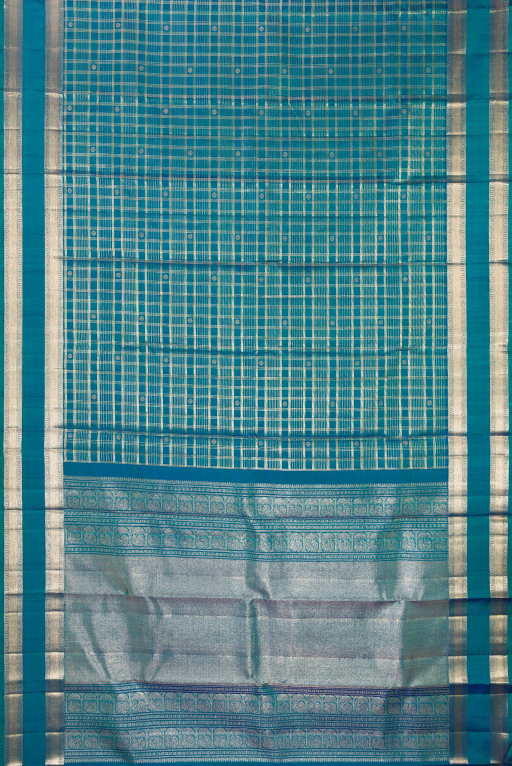 Flat view of Pure Silk Peacock Blue Dual Tone Kanchipuram Saree with Checked design on the body and Zari Border. 