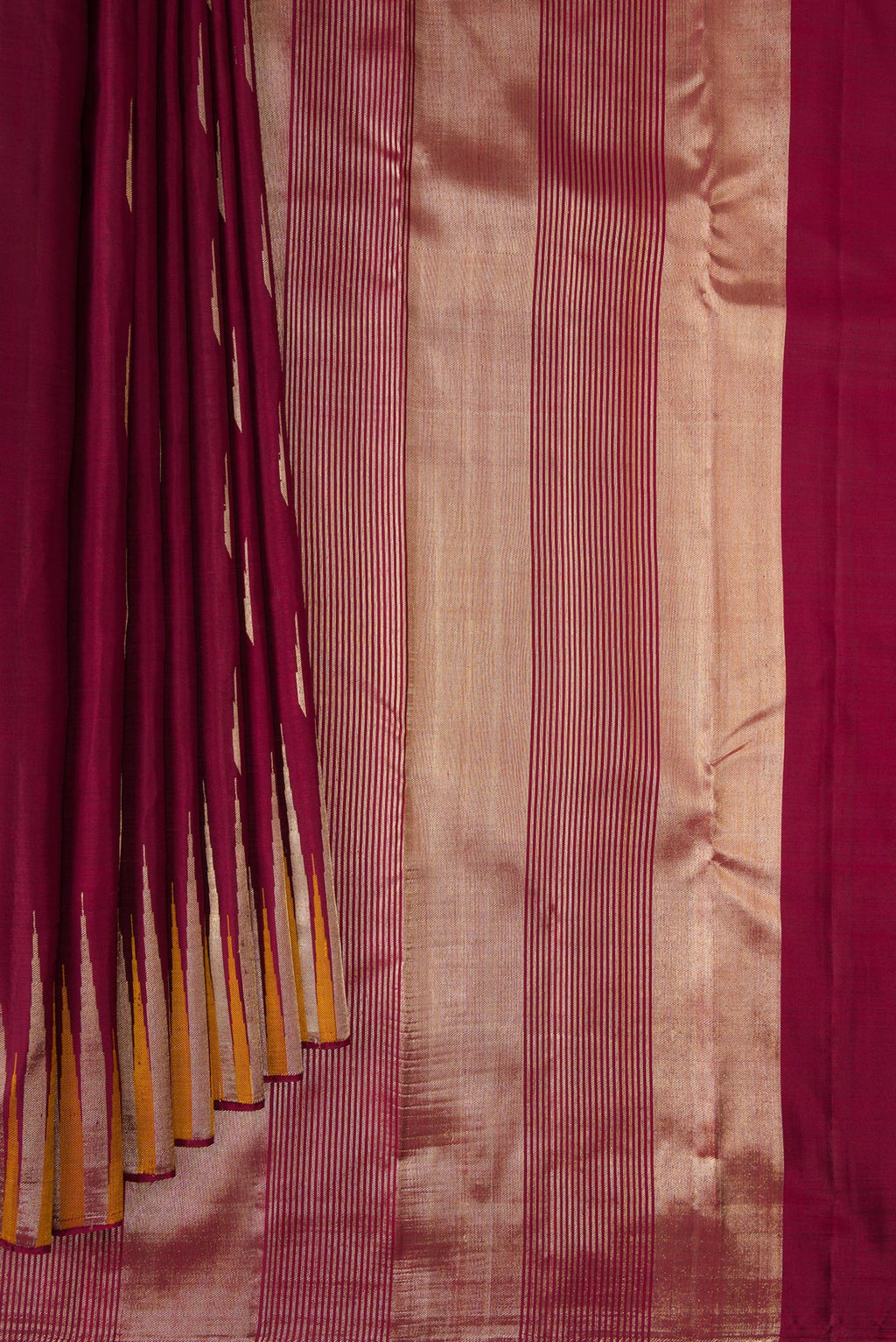 Pleats and pallu of Pure Silk Maroon Kanjivaram Saree with Zari Butta on the body and Fancy Border. 