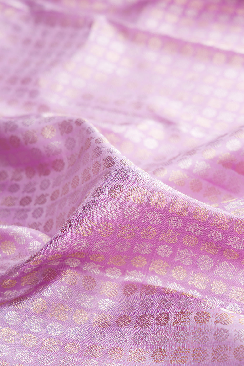 Close up of Pure Silk Lavender Kanchipuram Saree with Zari Brocade on the body and Zari Border.  displaying folds