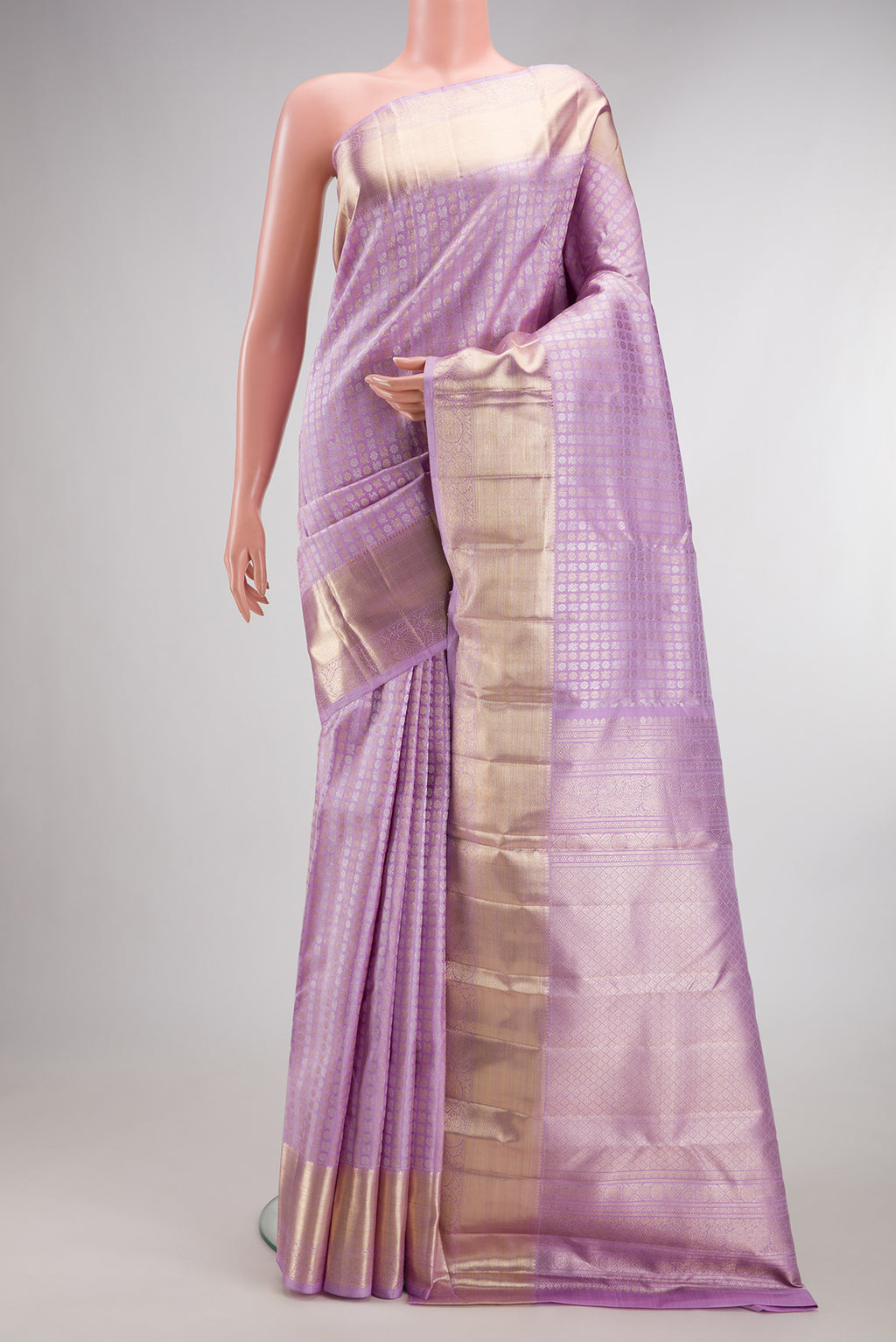 Pure Silk Lavender Kanchipuram Saree with Zari Brocade on the body and Zari Border.  displayed on a mannequin