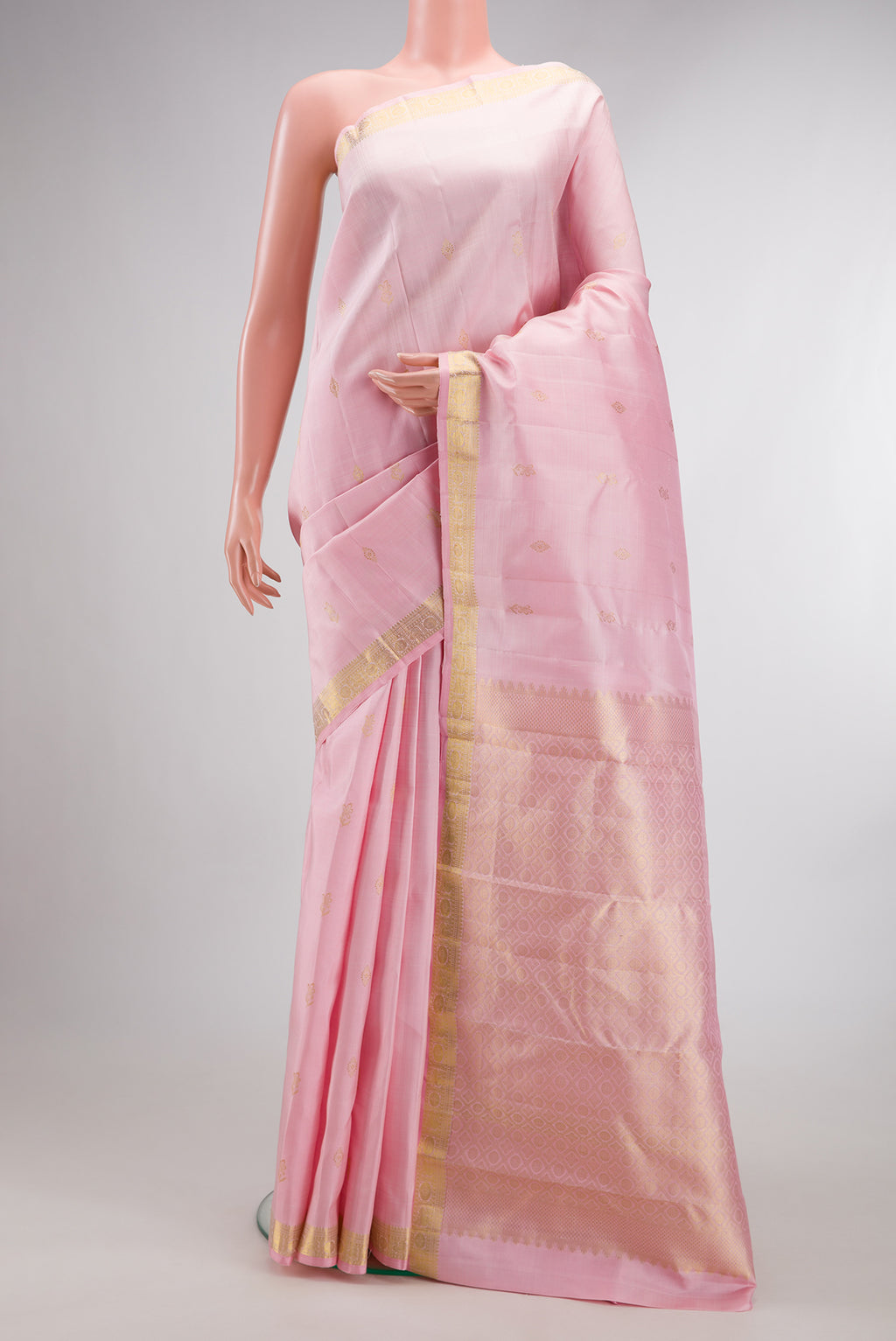 Pure Silk Rose pink Kanjivaram Saree with Zari Butta on the body and Zari Border.  displayed on a mannequin