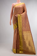 Pure Silk Caramel Kanjivaram Saree with Zari Butta on the body and Zari Border.  displayed on a mannequin