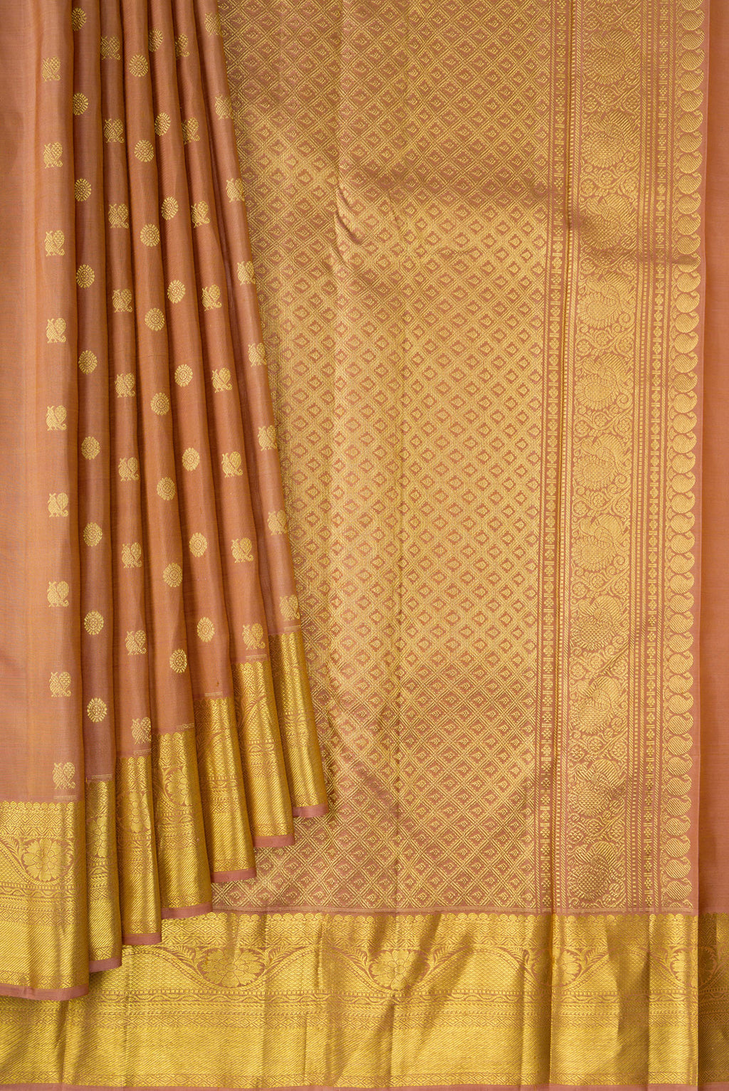 Pleats and pallu of Pure Silk Caramel Kanjivaram Saree with Zari Butta on the body and Zari Border. 