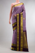 Pure Silk Lavender Kanchipuram Saree with Zari Butta on the body and Zari Border.  displayed on a mannequin