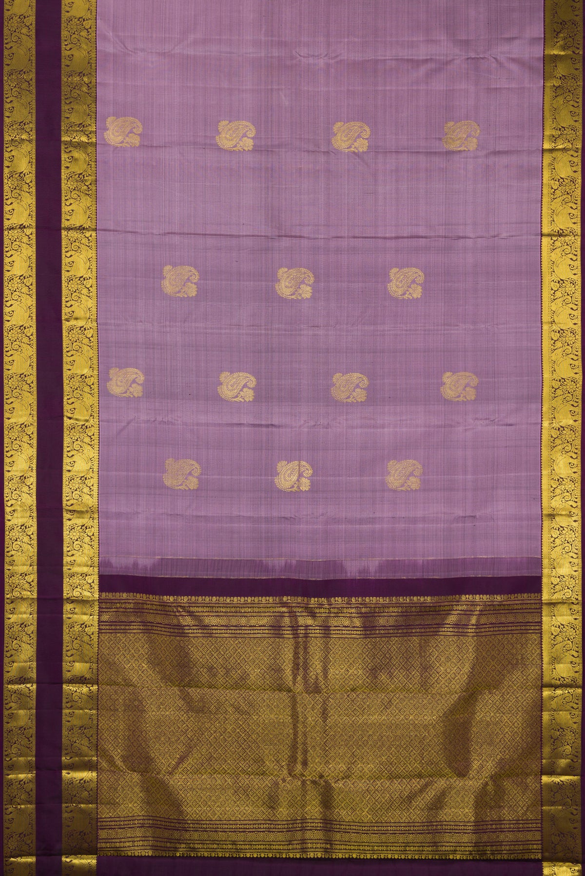 Flat view of Pure Silk Lavender Kanchipuram Saree with Zari Butta on the body and Zari Border. 