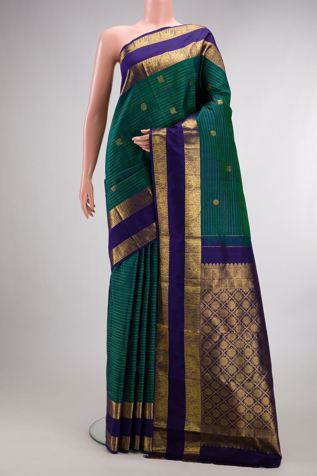 Pure Silk Green Dual Tone Kanchipuram Saree with Zari Butta on the body and Zari Border.  displayed on a mannequin