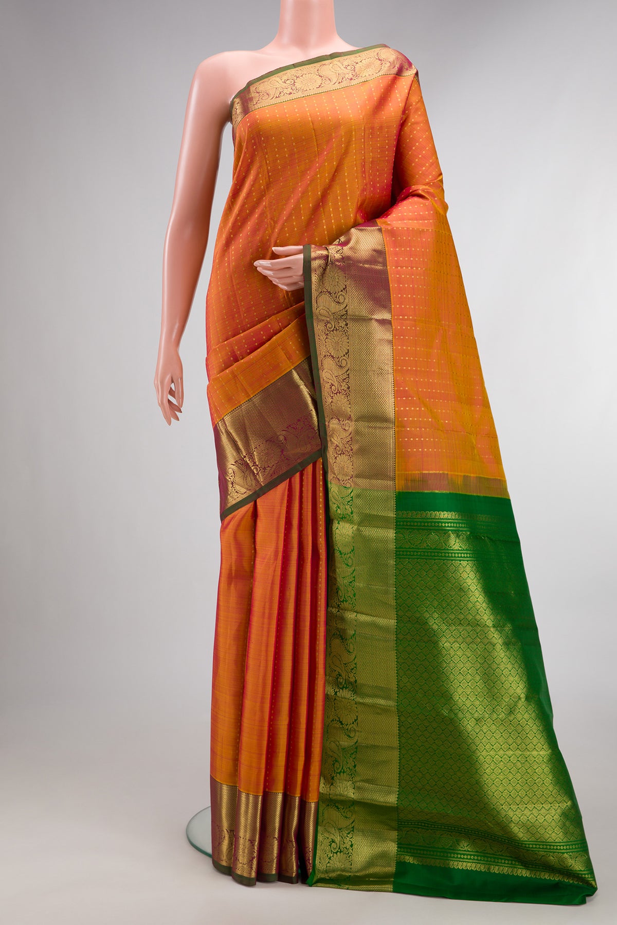 Pure Silk Mustard Dual Tone Kanchipuram Saree with Zari Butta on the body and Zari Border.  displayed on a mannequin