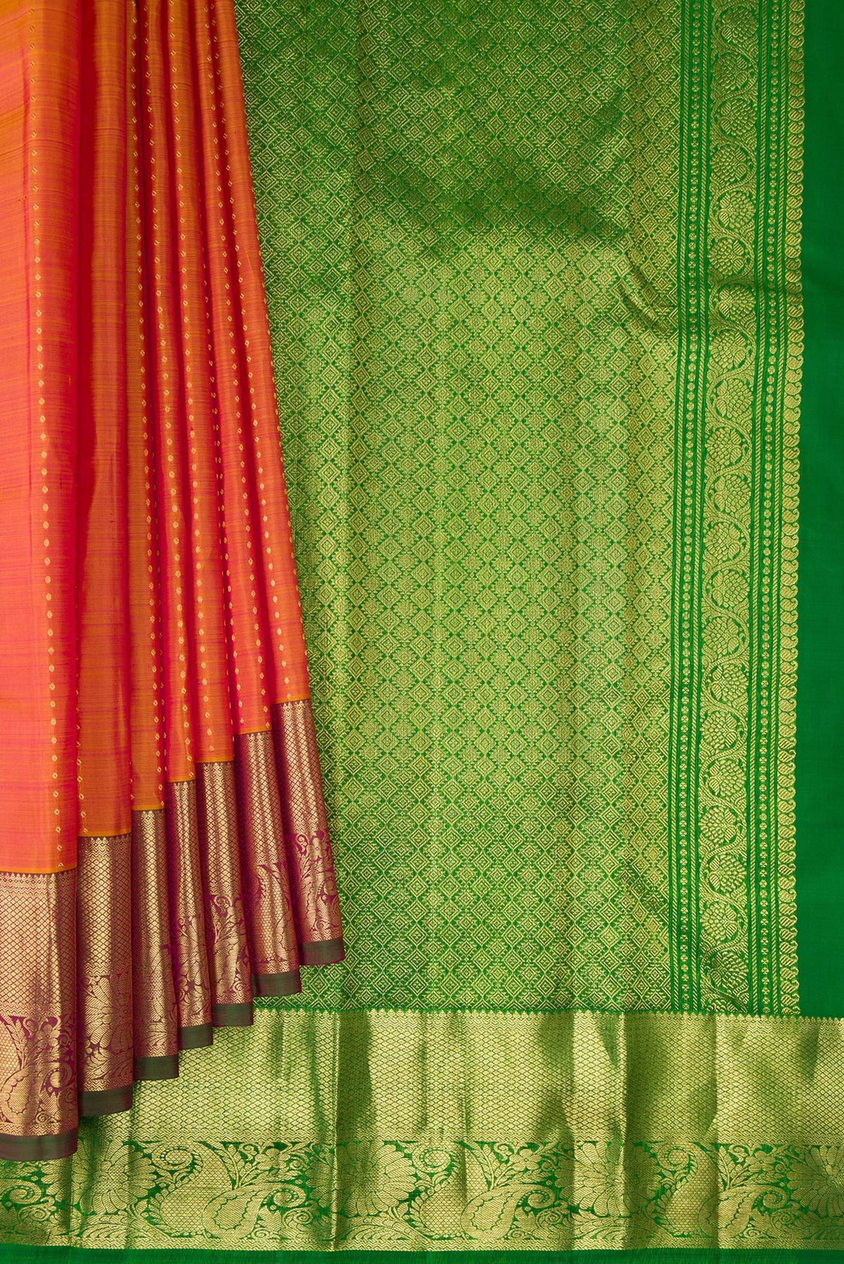 Pleats and pallu of Pure Silk Mustard Dual Tone Kanchipuram Saree with Zari Butta on the body and Zari Border. 