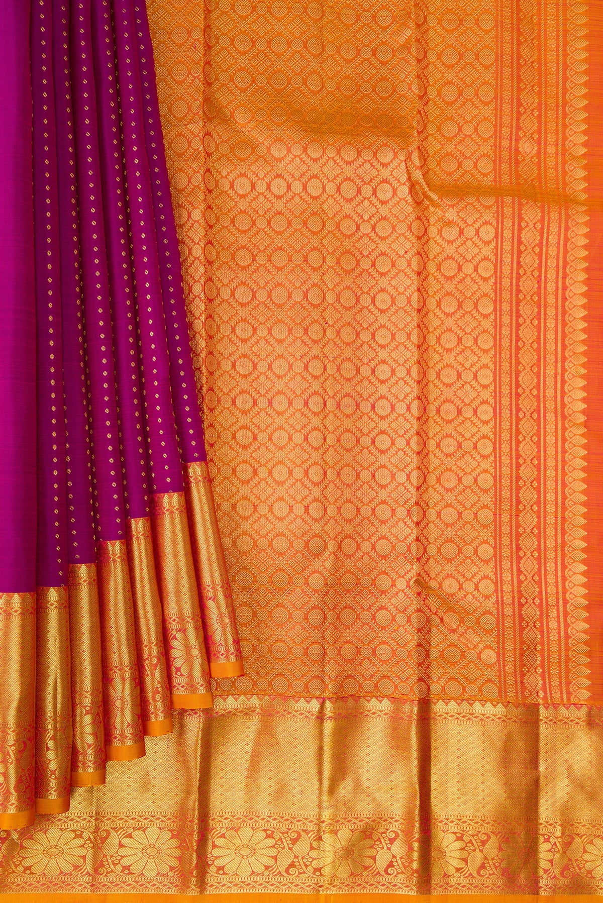 Pleats and pallu of Pure Silk Magenta Kanchipuram Saree with Zari Butta on the body and Zari Border. 
