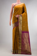 Pure Silk Mustard Kanchipuram Saree with Checked design on the body and Zari Border.  displayed on a mannequin