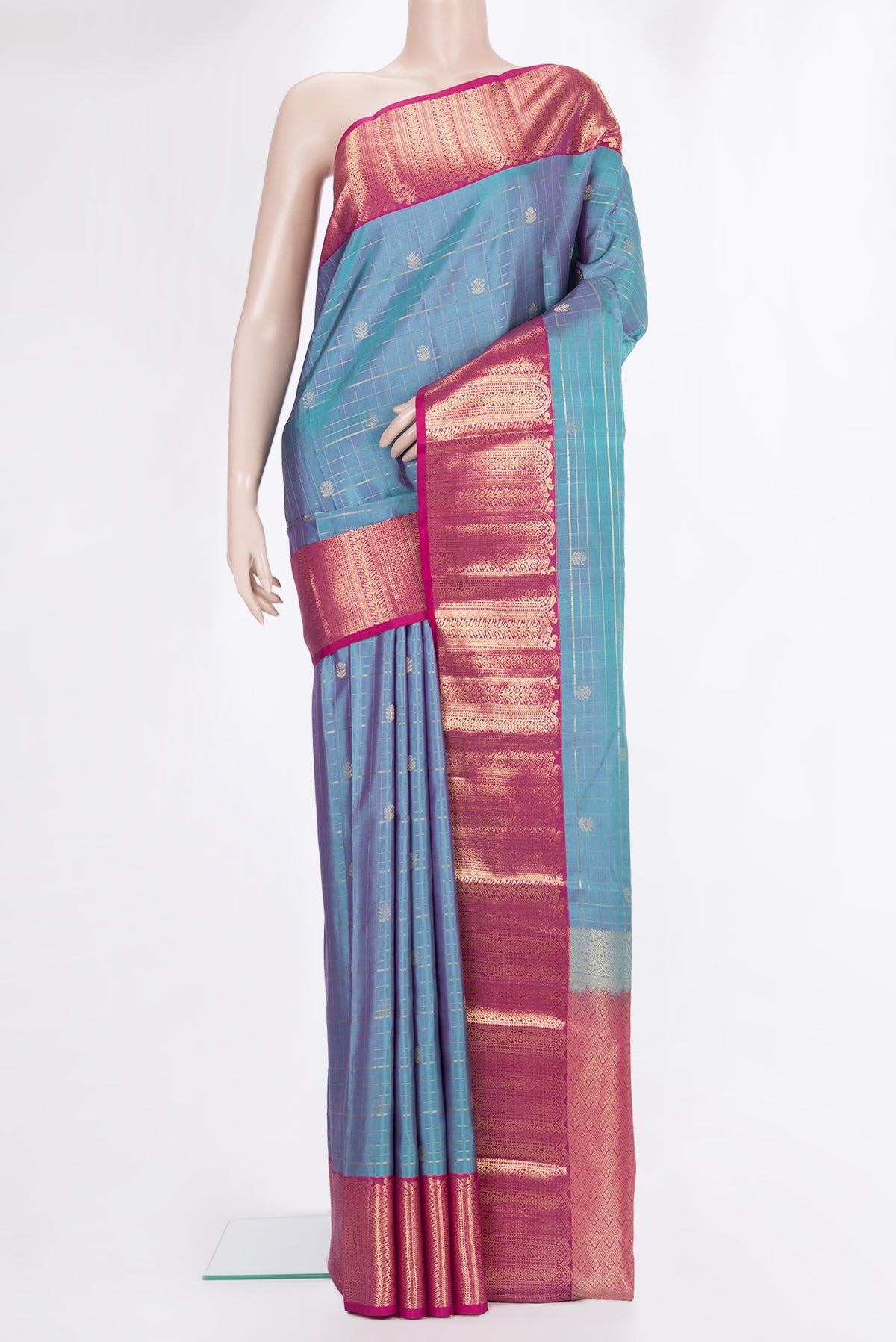 Pure Silk Peacock Blue Dual Tone Kanchipuram Saree with Checked design on the body and Zari Border.  displayed on a mannequin