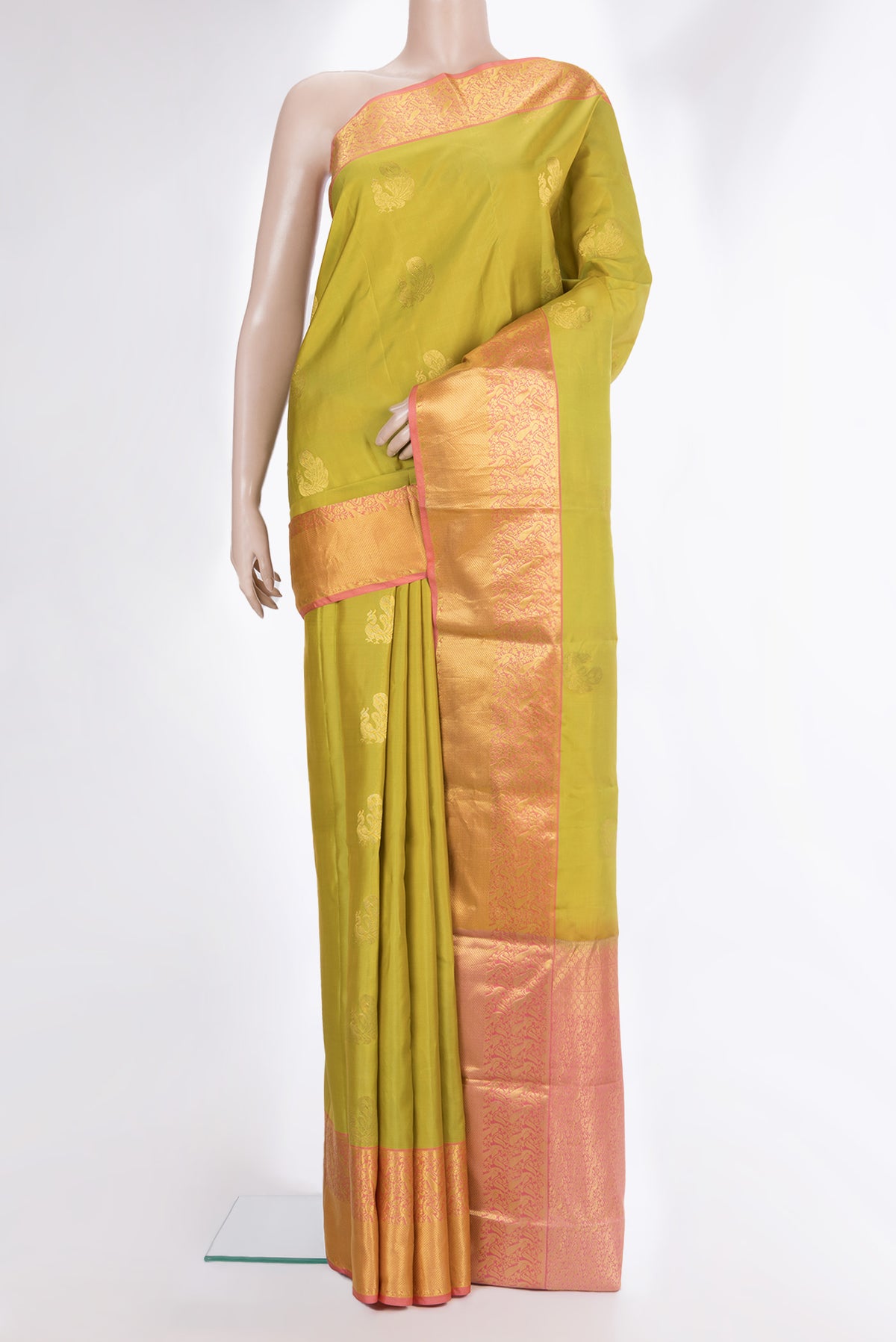 Pure Silk Parrot Green Kanchipuram Saree with Zari Butta on the body and Zari Border.  displayed on a mannequin