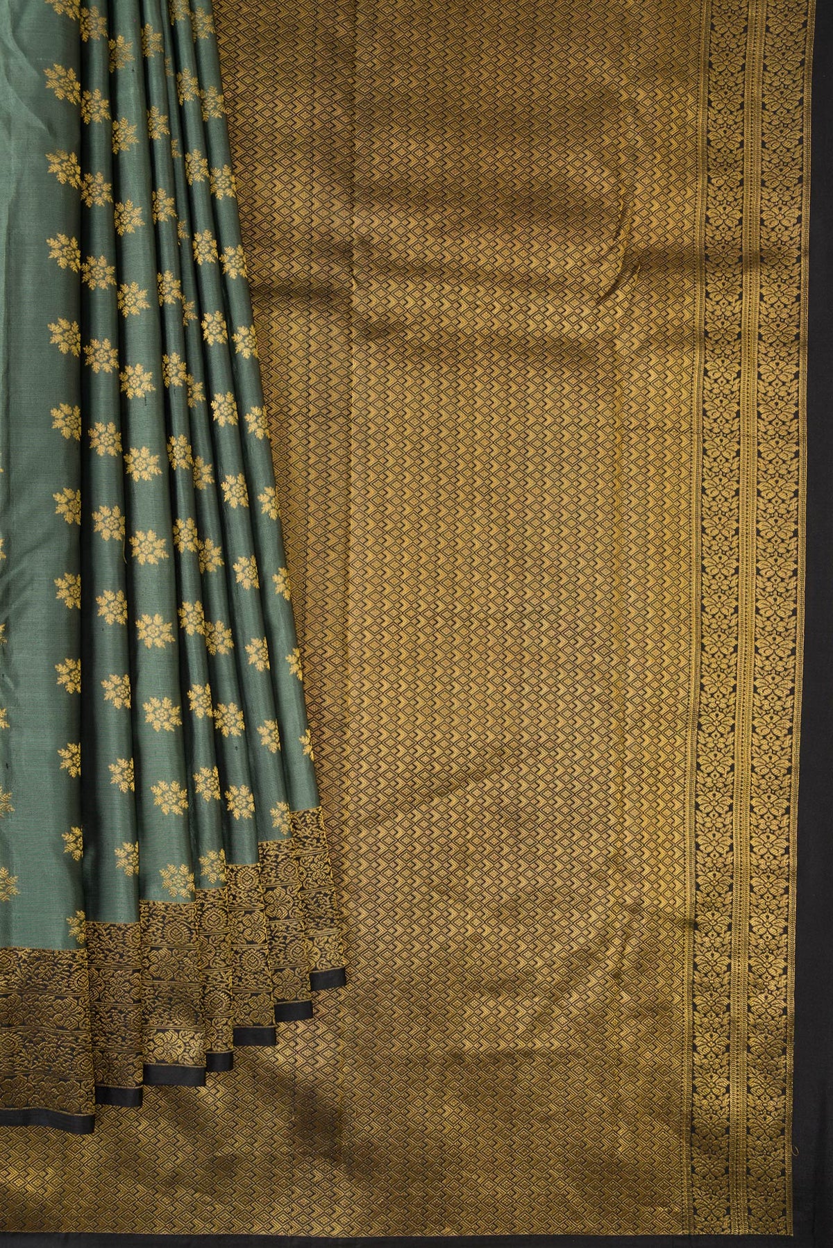 Pleats and pallu of Pure Silk Olive Green Kanchipuram Saree with Zari Butta on the body and Zari Border. 