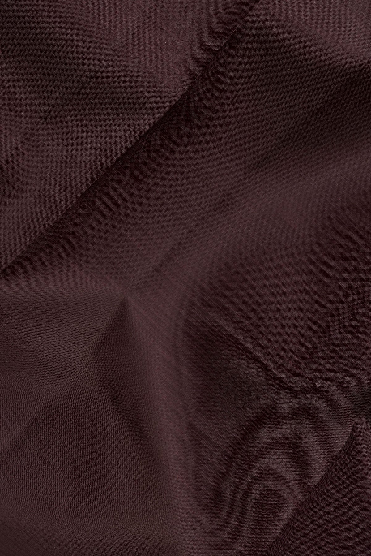 Close up of Pure Silk Coffee Brown Dual Tone Kanjivaram Saree with Plain Body and Thread Border.  displaying folds