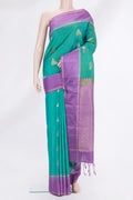 Pure Silk Sea Green Kanchipuram Saree with Zari Butta on the body and Zari Border.  displayed on a mannequin