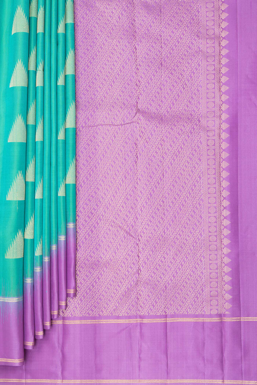 Pleats and pallu of Pure Silk Sea Green Kanchipuram Saree with Zari Butta on the body and Zari Border. 