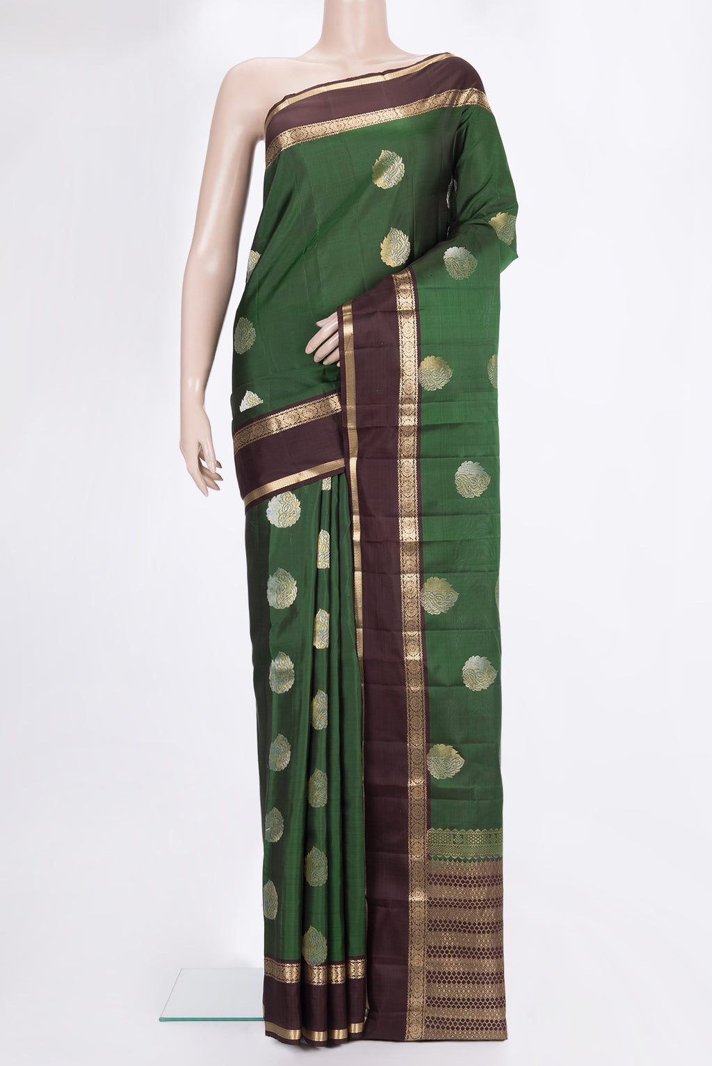 Pure Silk Green Kanchipuram Saree with Zari Butta on the body and Zari Border.  displayed on a mannequin