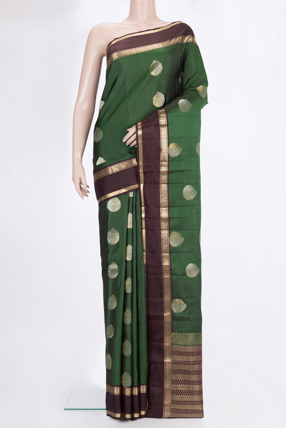 Pure Silk Green Kanchipuram Saree with Zari Butta on the body and Zari Border.  displayed on a mannequin