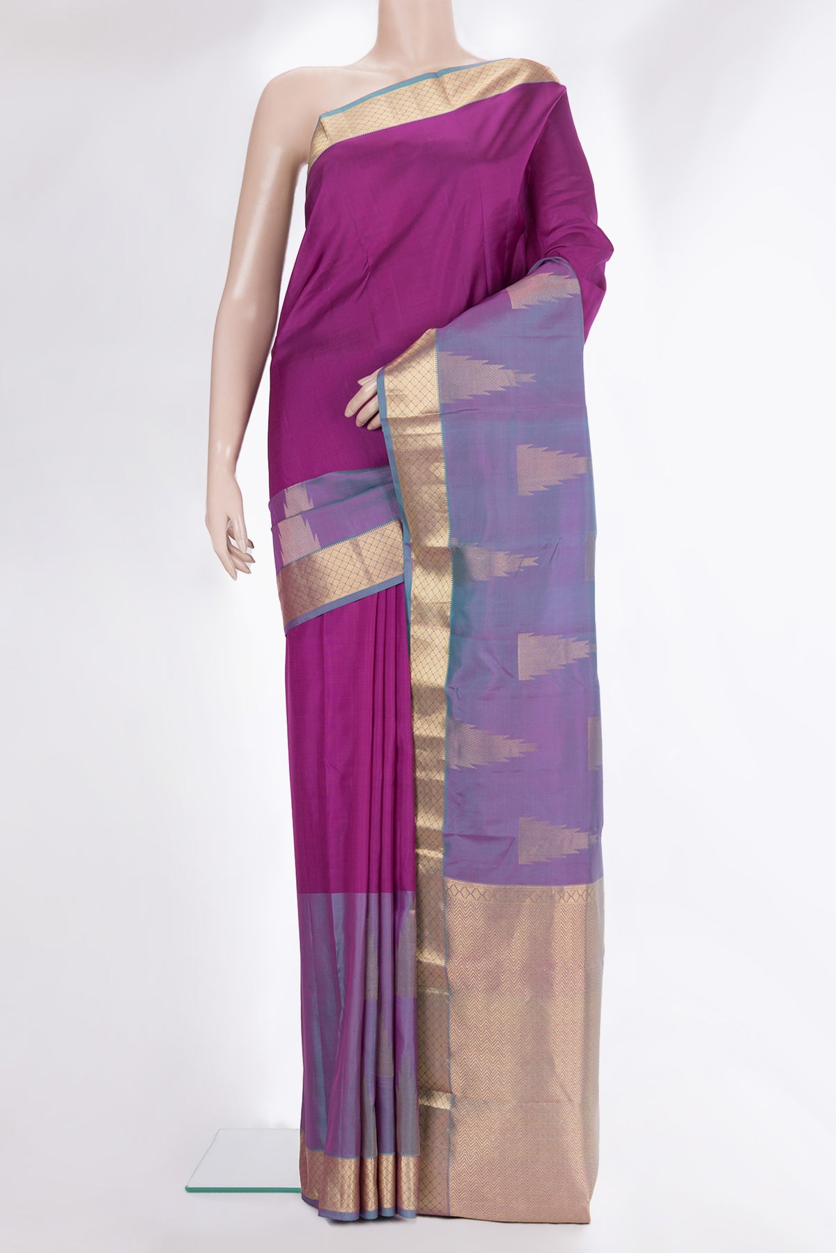 Pure Silk Magenta Kanchipuram Saree with Plain Body and Fancy Border.  displayed on a mannequin